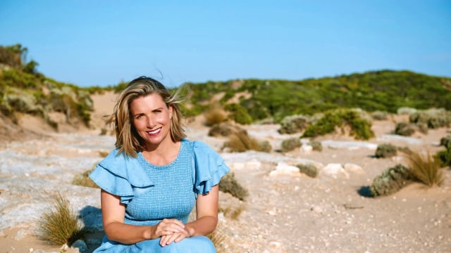 Fleur Chambers — Woman in blue dress, sandy landscape