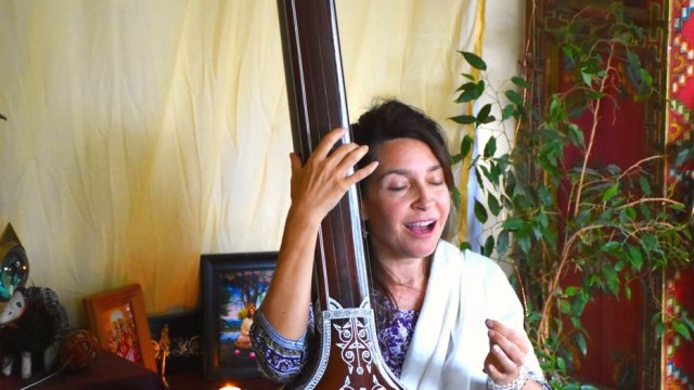 Gina Sala — Woman playing erhu instrument