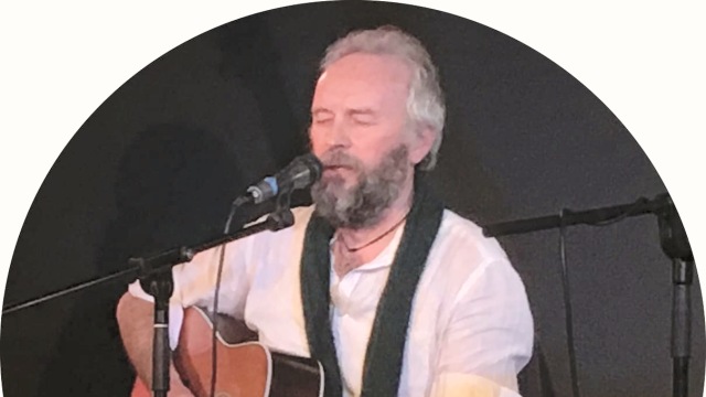 Jack Harrison — Bearded musician performing with microphone