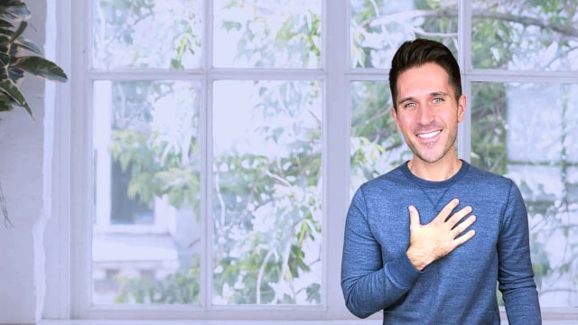 Michael Galyon — Man smiling by bright windows