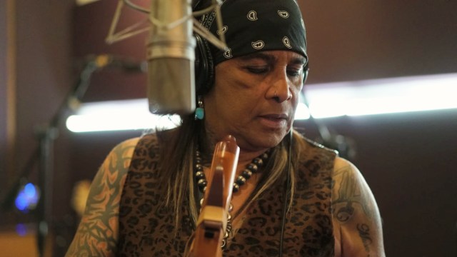 Micki Free — Artist recording at studio microphone