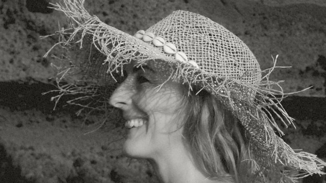 Rachel Fearnley — Black and white profile portrait with artistic mesh hat