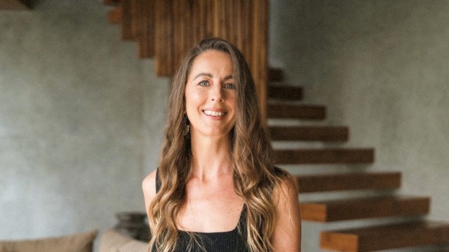 Rachel Fearnley — Woman smiling in modern interior setting