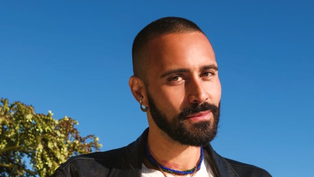 Sah D'Simone — Bearded man in leather jacket by the ocean