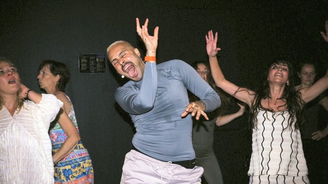Sah D'Simone — Man celebrating and dancing at party
