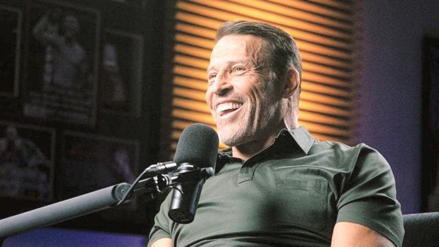 Tony Robbins — Man speaking at podcast microphone