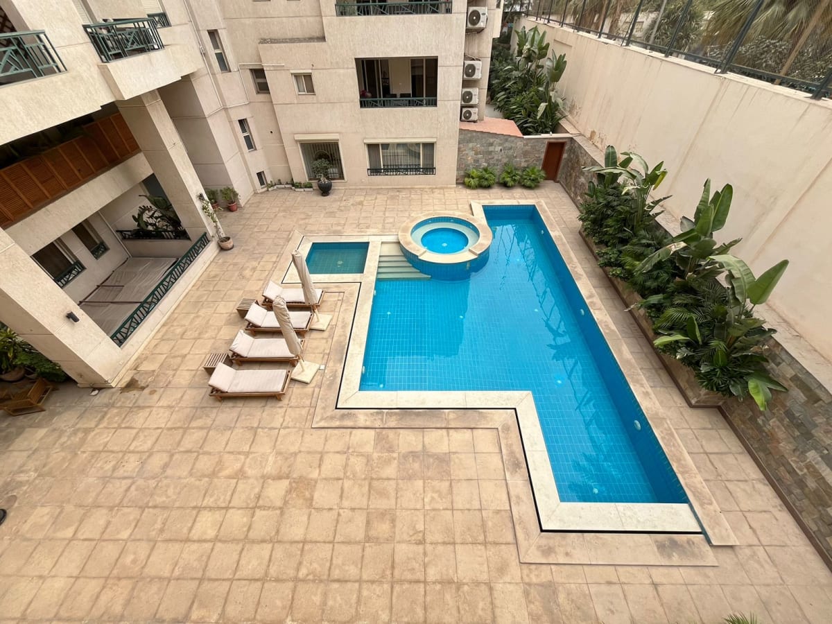 2BR Apartment with Green Views and Shared Pool