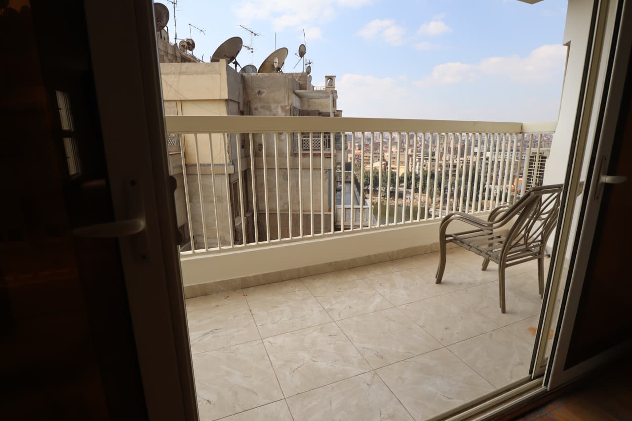 Serene Furnished Apartment With Breathtaking Nile Scenery In Zamalek.