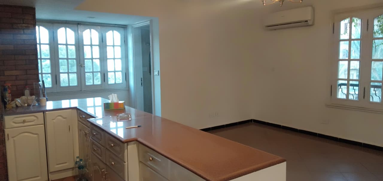 Modern Semi-Furnished Apartment with Kitchen Appliances.