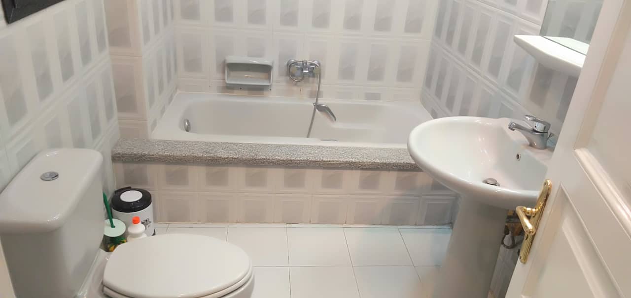 Modern Semi-Furnished Apartment with Kitchen Appliances.