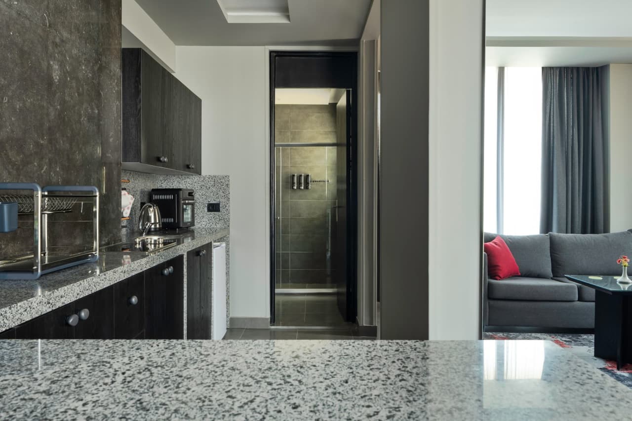 Modern 1BR in New Cairo with Balcony & roof access — First New Cairo Qism