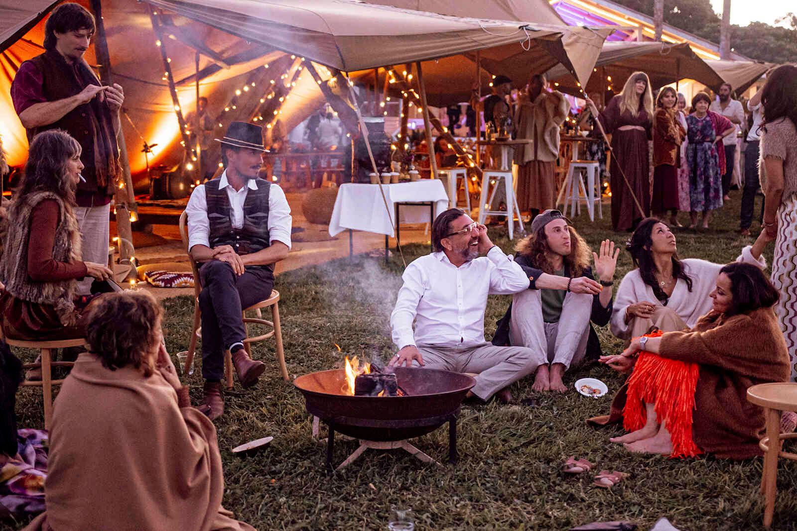 wedding_guests_fire_pit_lounge_area_tipi_reception_75e6d74770