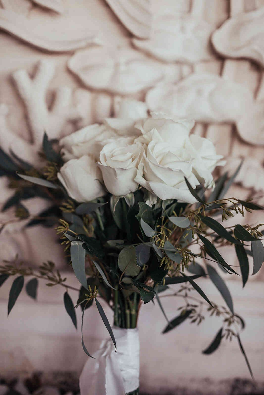 sarah_and_jeff_bride_white_rose_and_eucalyptus_bouquet_close_up_fcefbf9dd1