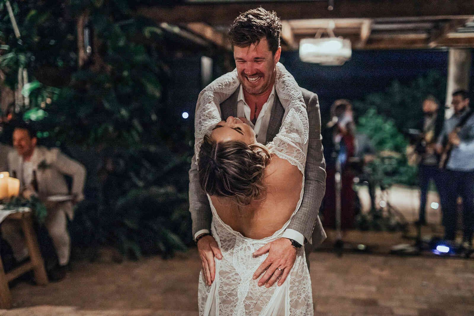 sarah_and_jeff_first_dance_groom_dipping_bride_low_back_dress_ea70066adc