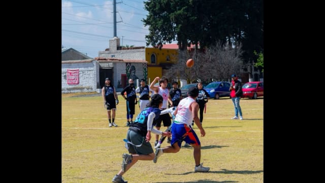 Flag football player on a field representing USA Football's Summer Series event in Los Angeles