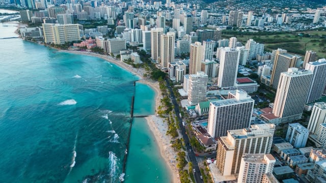 Waikīkī and Honolulu coastline representing Hawaiʻi-born Team USA flag football player Akemi Higa
