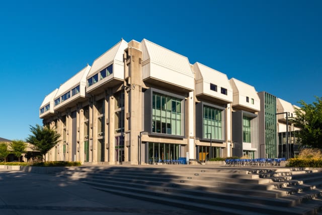 College campus building representing women’s flag football varsity program growth