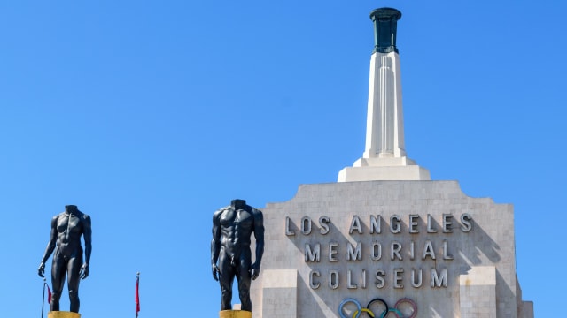 Los Angeles Memorial Coliseum entrance with Olympic rings, connecting LA28 flag football coverage to Southern California.