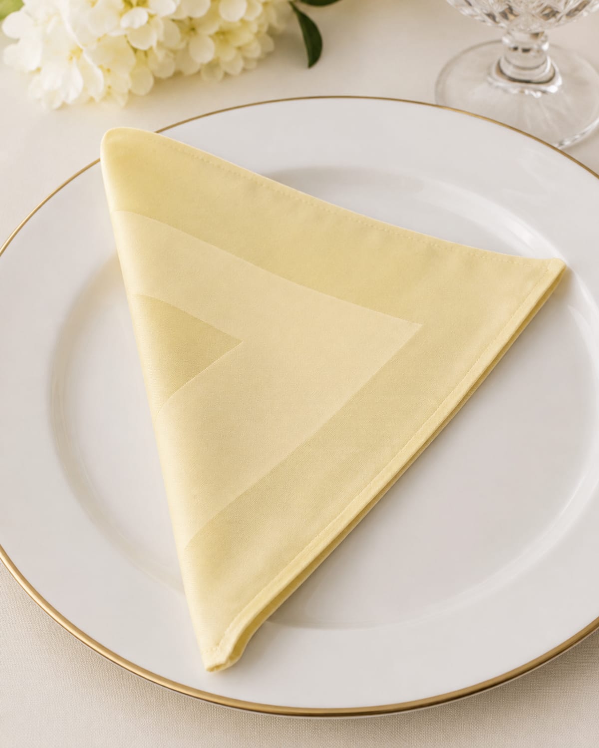 Ivory jacquard napkin on a place setting