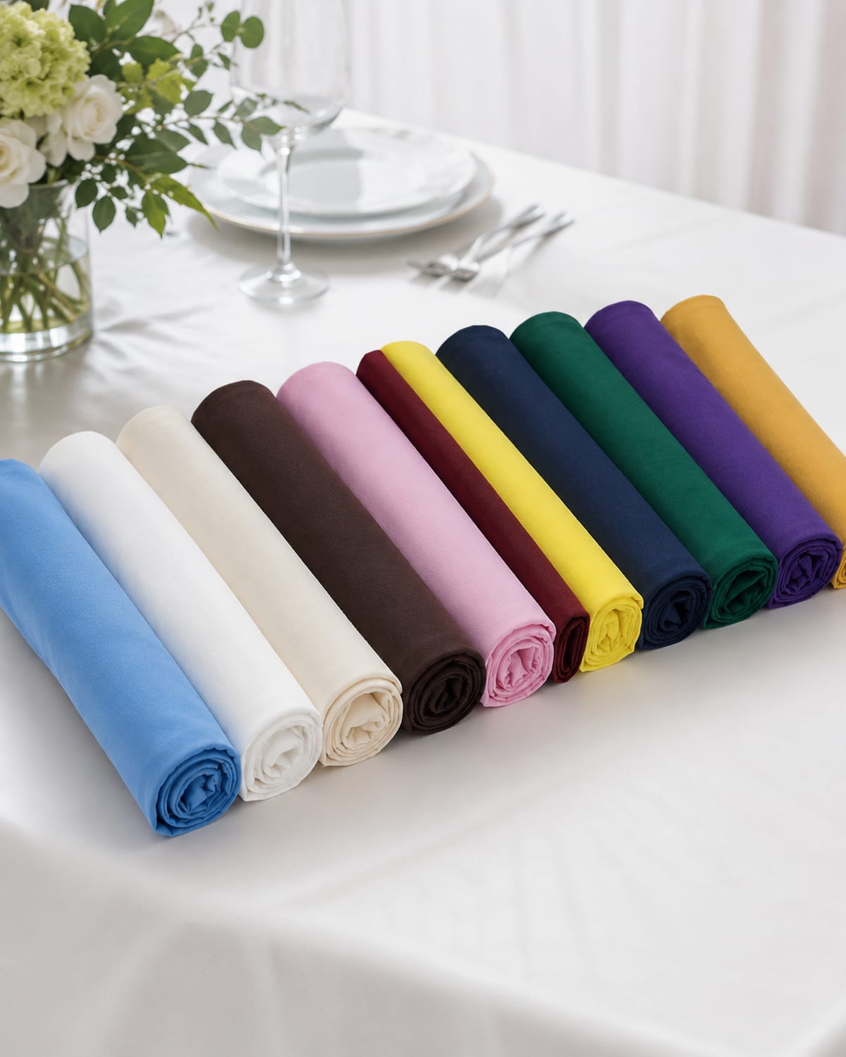 The full napkin colour range, from white and ivory to navy, burgundy and gold