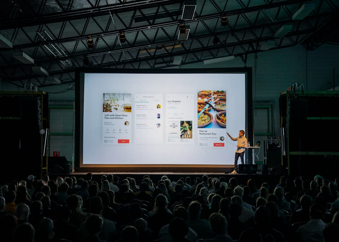 A vibrant product launch event with people showcasing new technology.