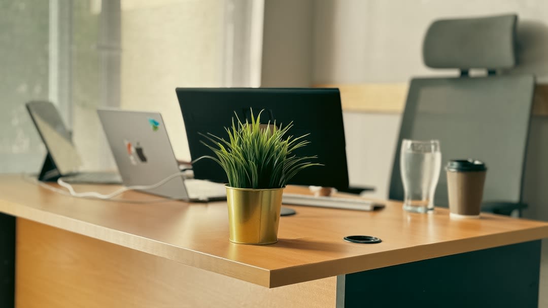 Developer working at a desk with multiple monitors and coding