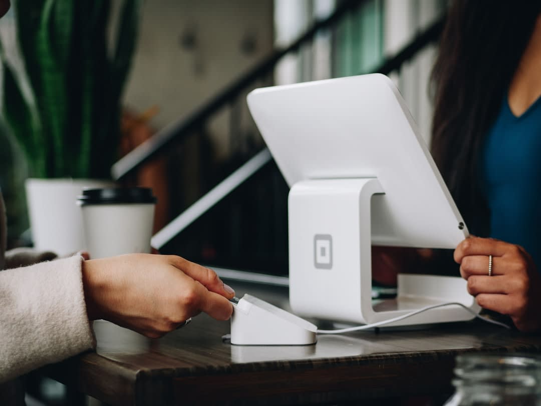 Small business owner processing payments