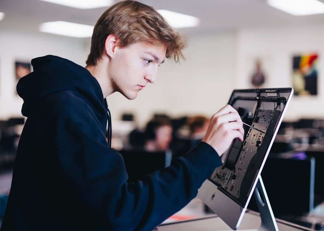 Students engaged with advanced technology in a modern classroom