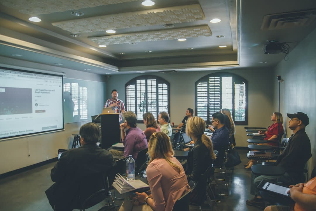 Students presenting their work during an oral defense in a classroom setting
