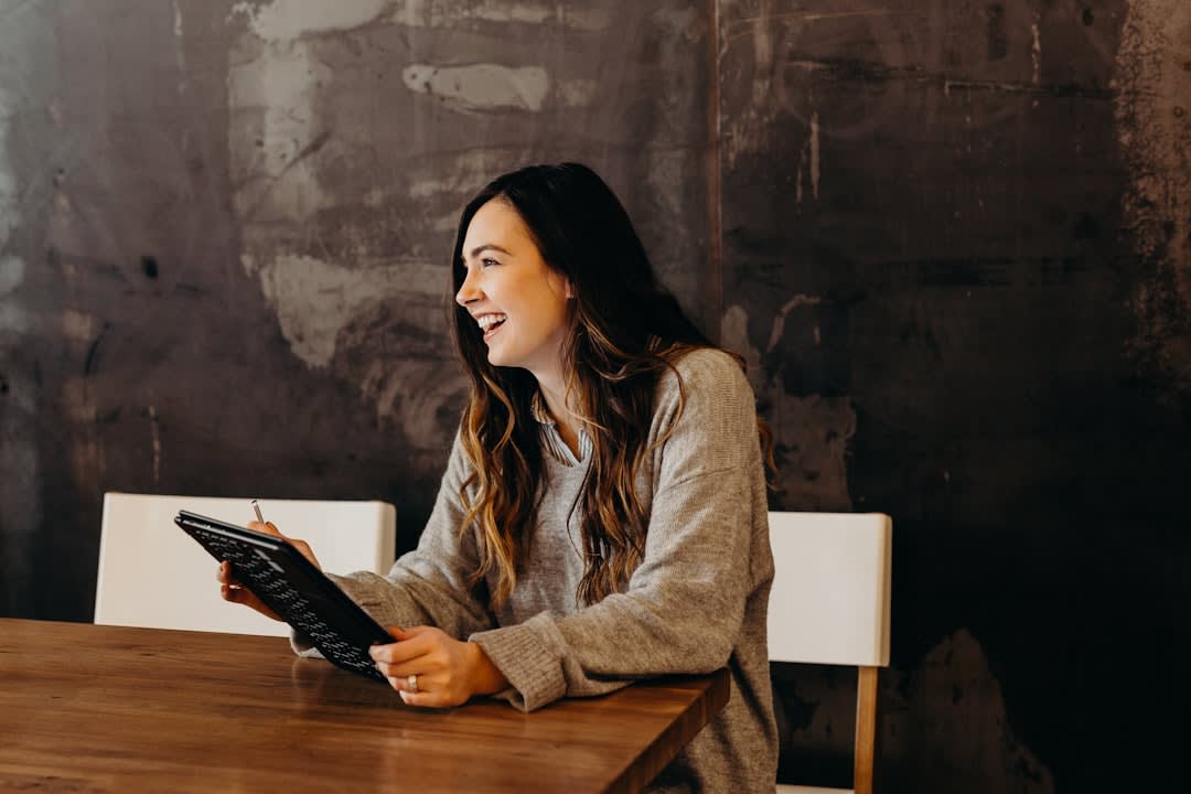 A smiling employee enjoying their work-from-home experience