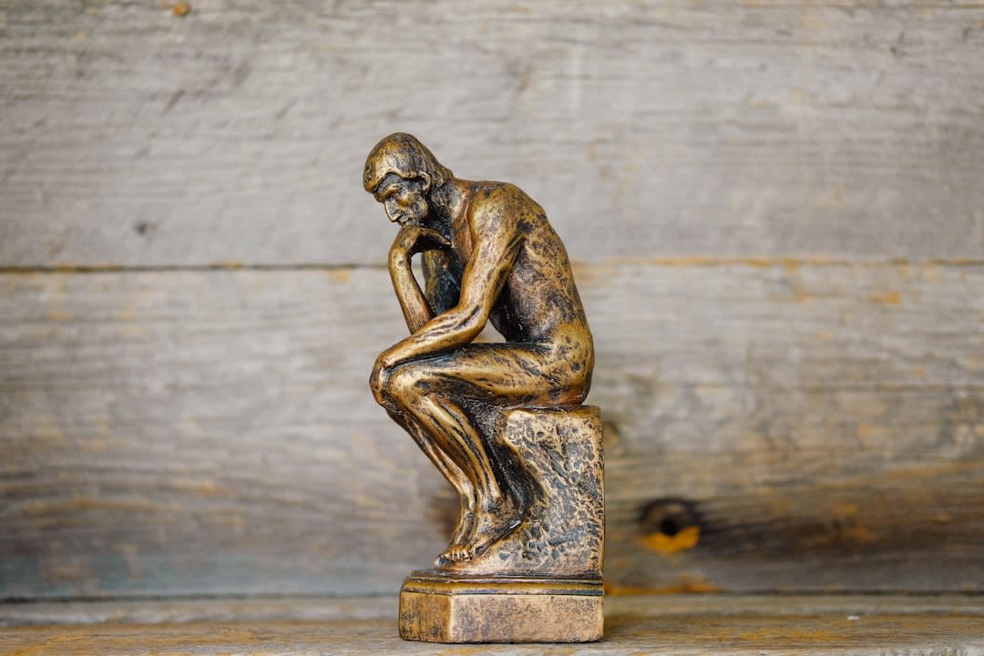 A pensive individual reflecting on life