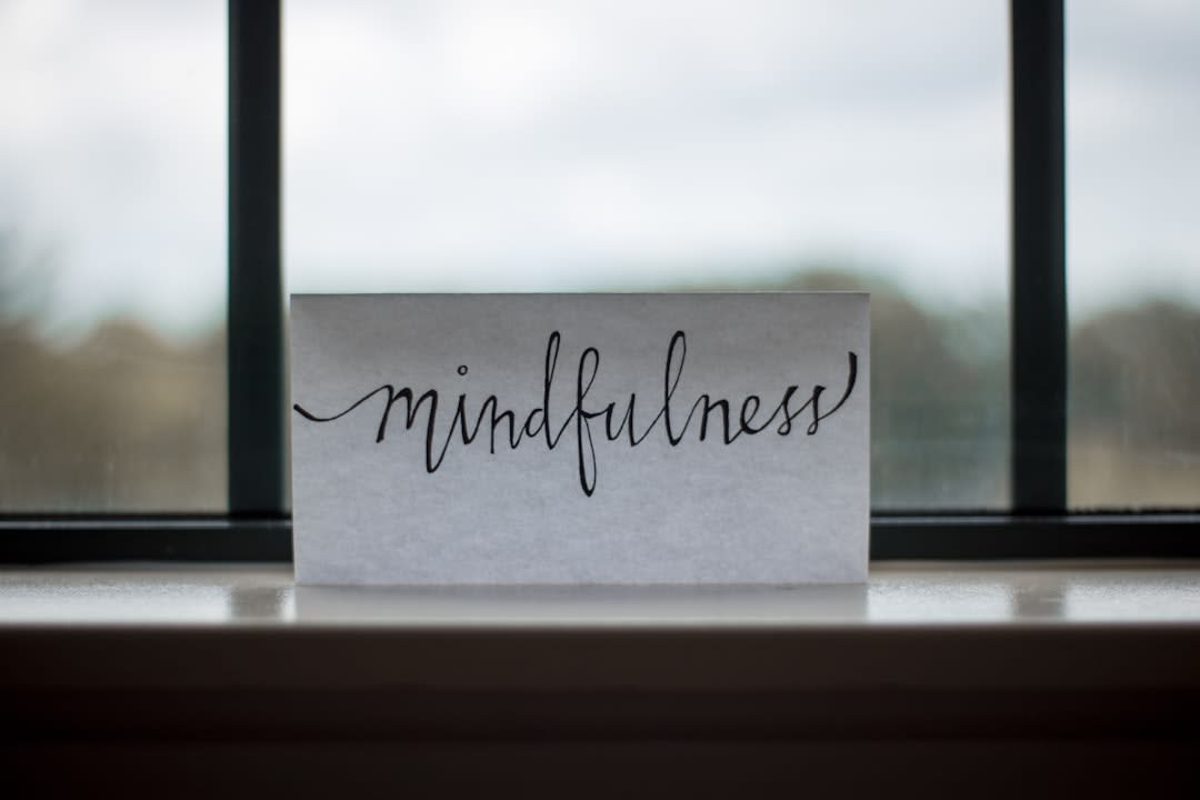 A person meditating in a serene environment