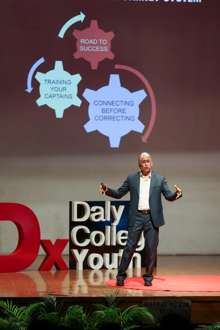 Sushant Kalra speaking on stage at a TEDx Youth event