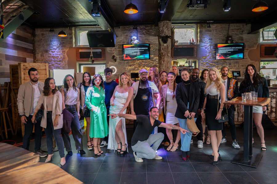 Group photo of chefs and team members at restaurant event gathering