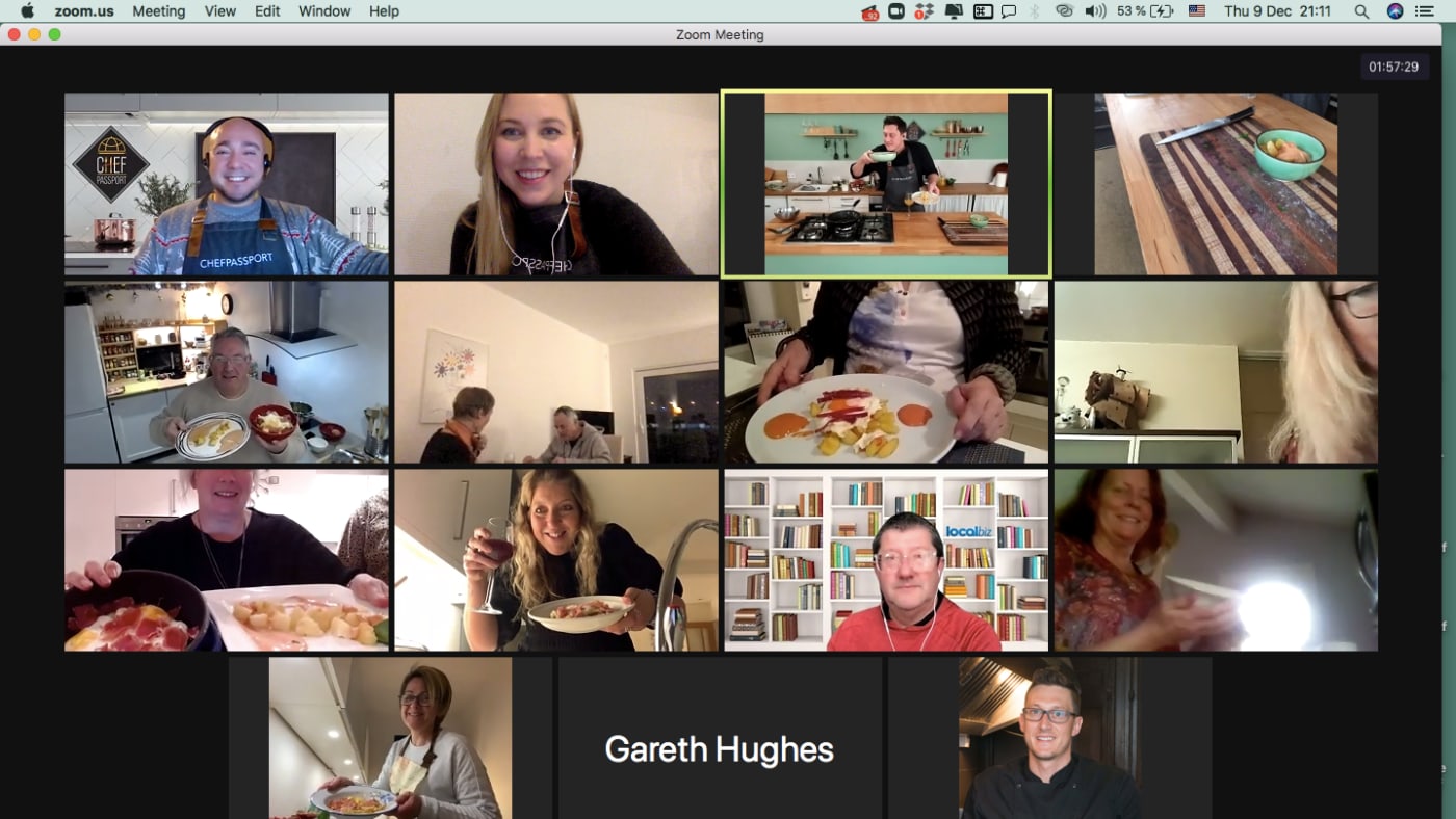 Zoom meeting screenshot showing multiple participants eating meals together in a virtual gathering