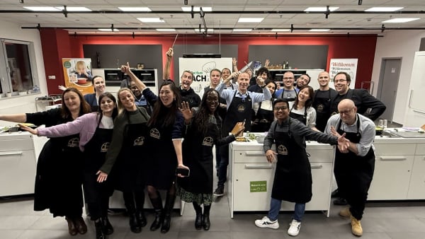 Corporate team celebrating at a ChefPassport cooking class in Luxembourg