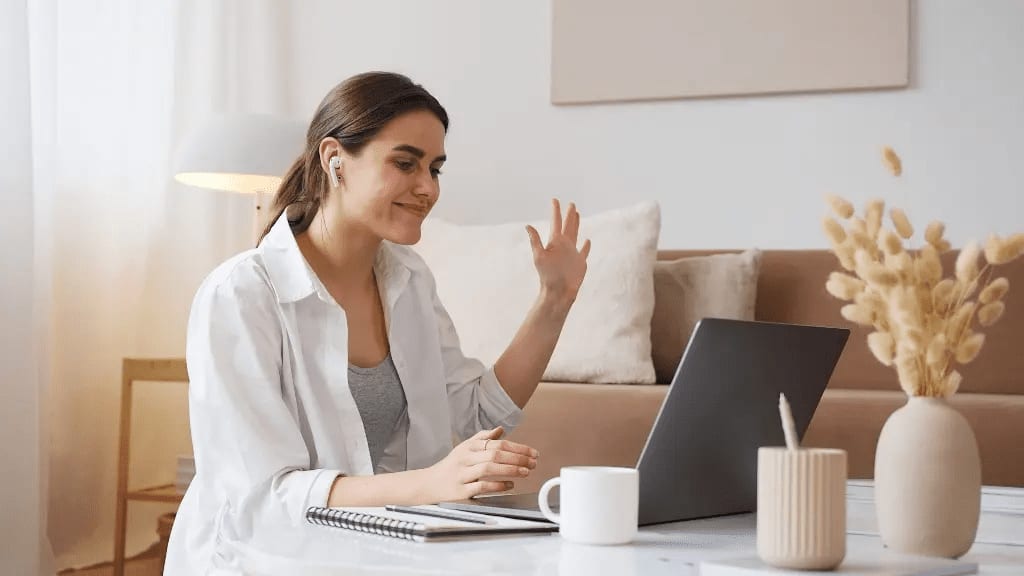 Chef teaching virtual cooking class to remote team participants on video conference