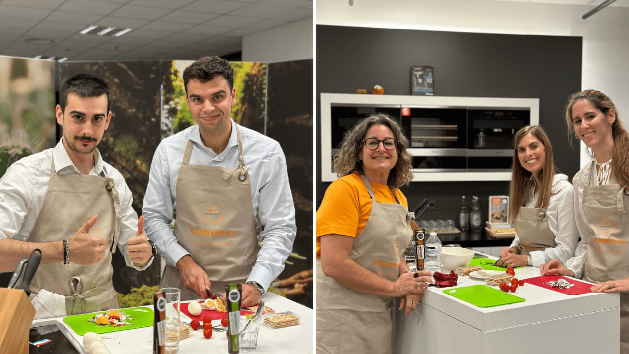 Two cooking class groups posing at kitchen workstations wearing beige aprons with ingredients
