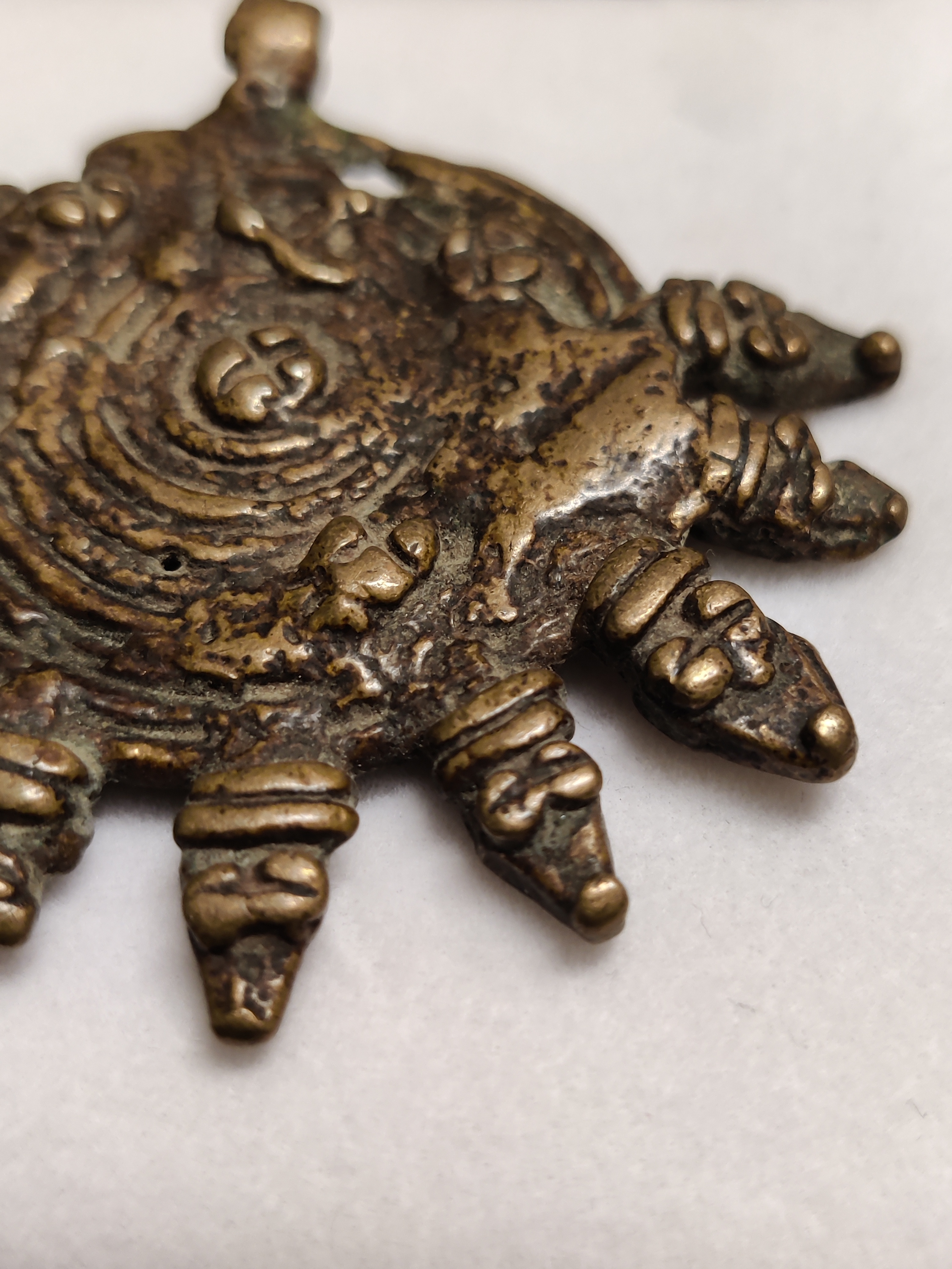 Sun akhan bronze with snake-like sunrays