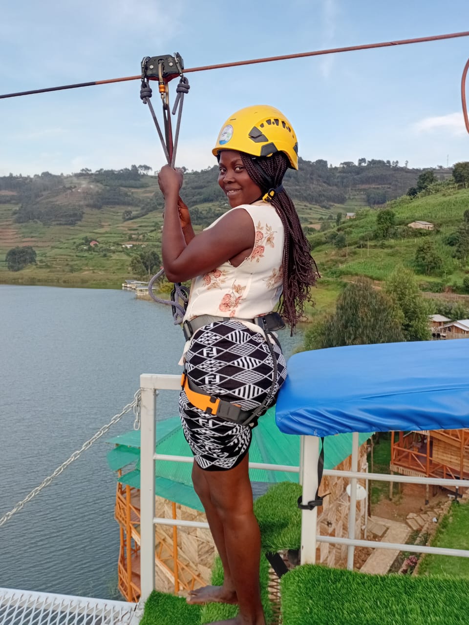 A guest getting ready to slide on Africa’s longest zipline at Bunyonyi Luxury Resort, overlooking Lake Bunyonyi.