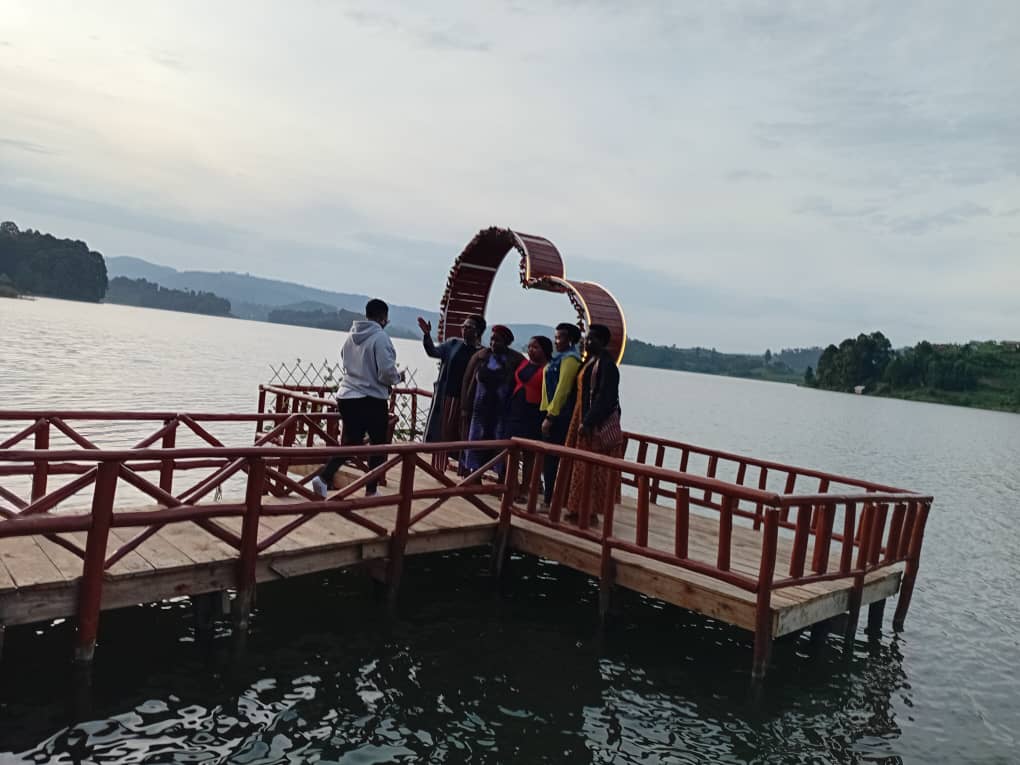 Guests enjoying selfie moments on Love Island at Bunyonyi Luxury Resort, overlooking Lake Bunyonyi.