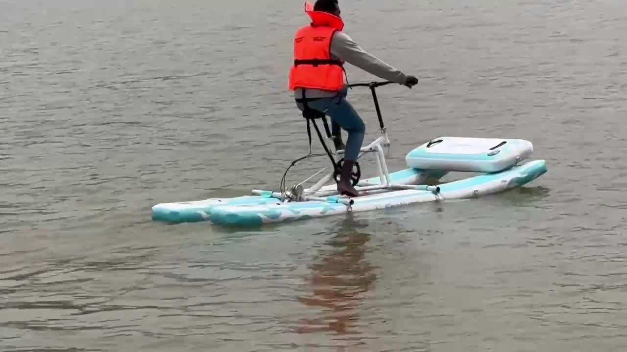 A guest riding a unique bicycle across the serene waters of Lake Bunyonyi, experiencing the one-of-a-kind water activity at Bunyonyi Luxury Resort.