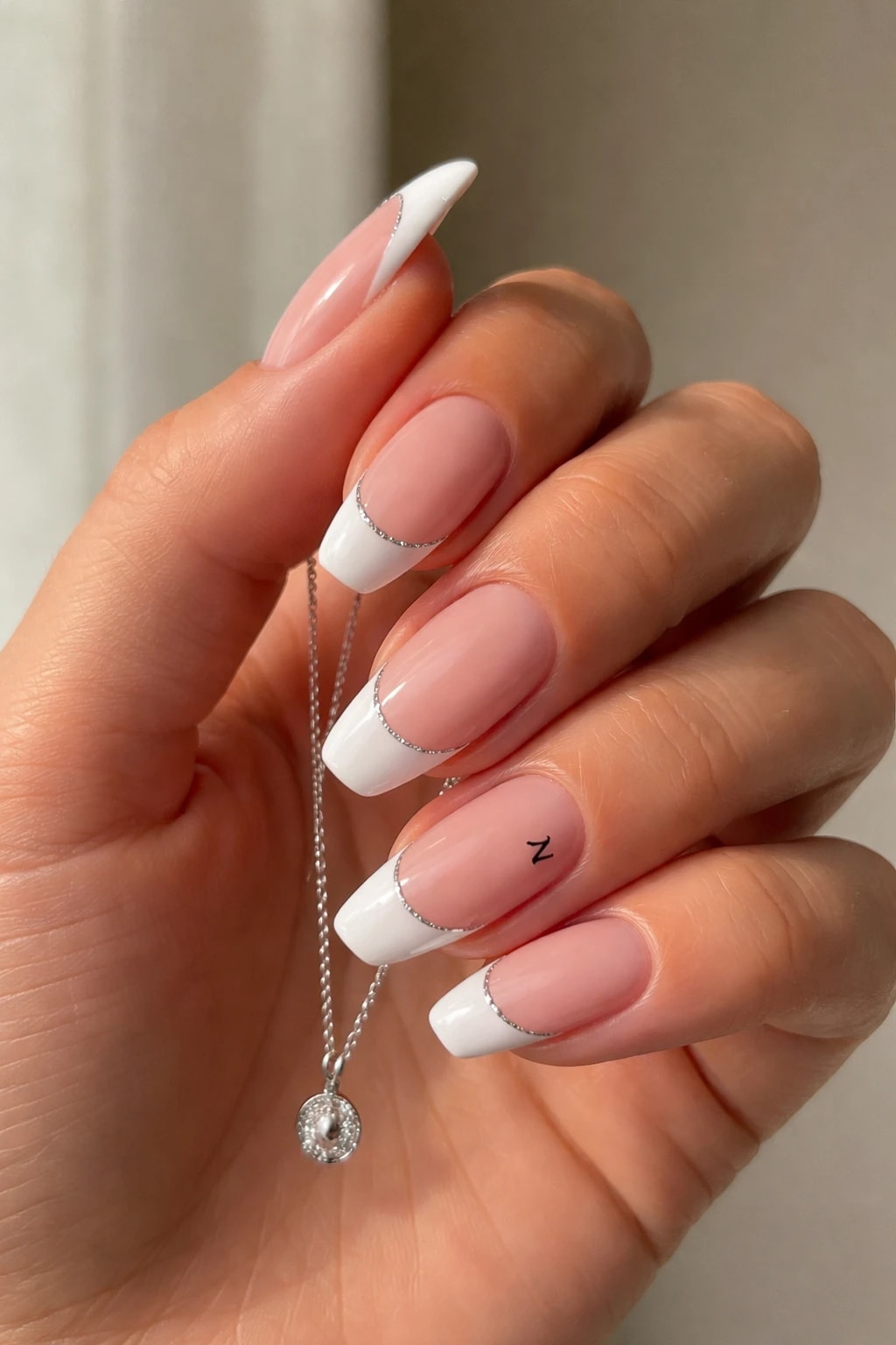 Silver-Edged French Tips With a Tiny Z for Soft Glam