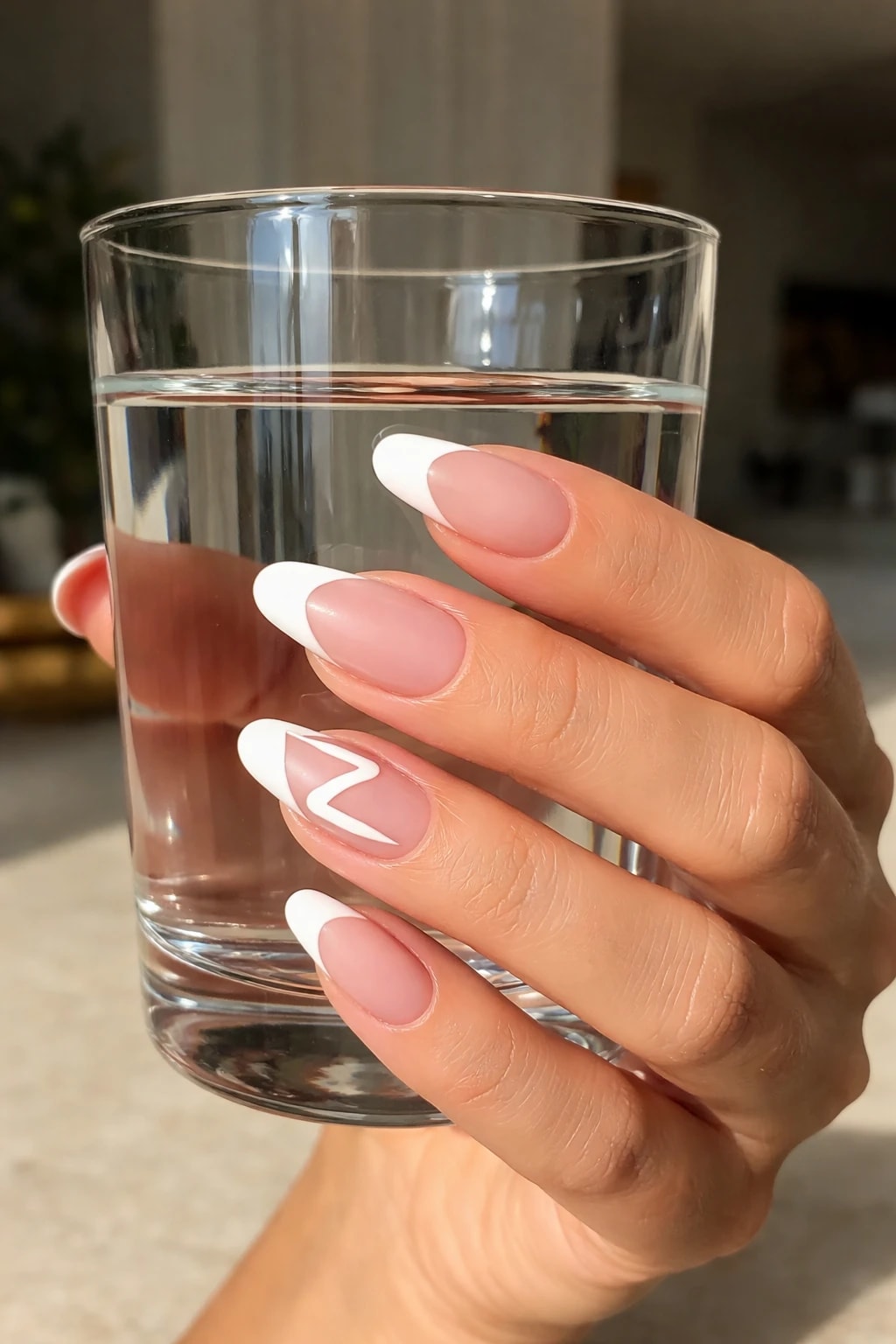 Graphic Z French Tip Accent on Soft Nude Almonds