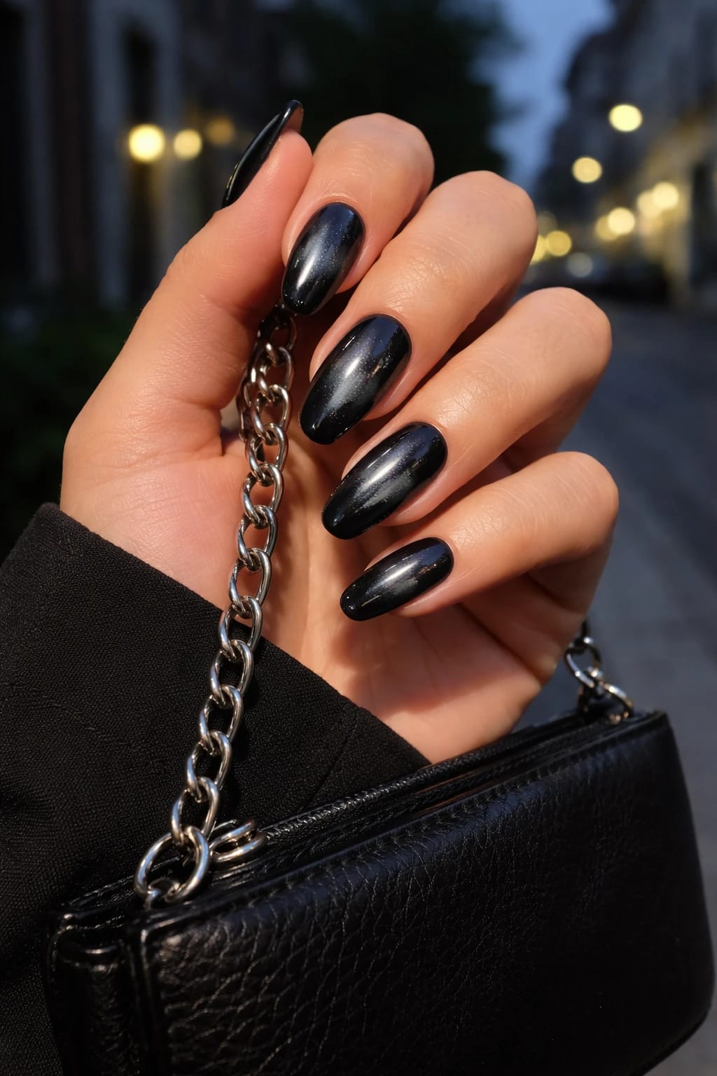 Black Almond Cat Eye Nails with Subtle Sparkle for Nights Out
