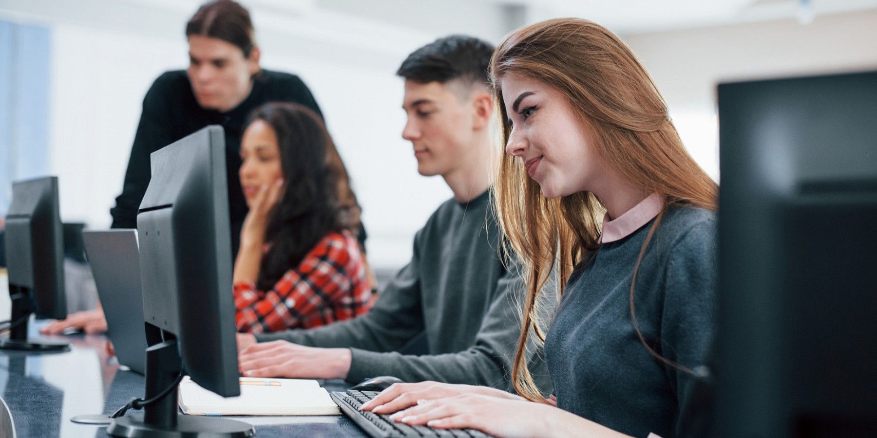 computer-screens-group-of-young-people-in-casual-clothes-working-in-the-modern-office.jpg