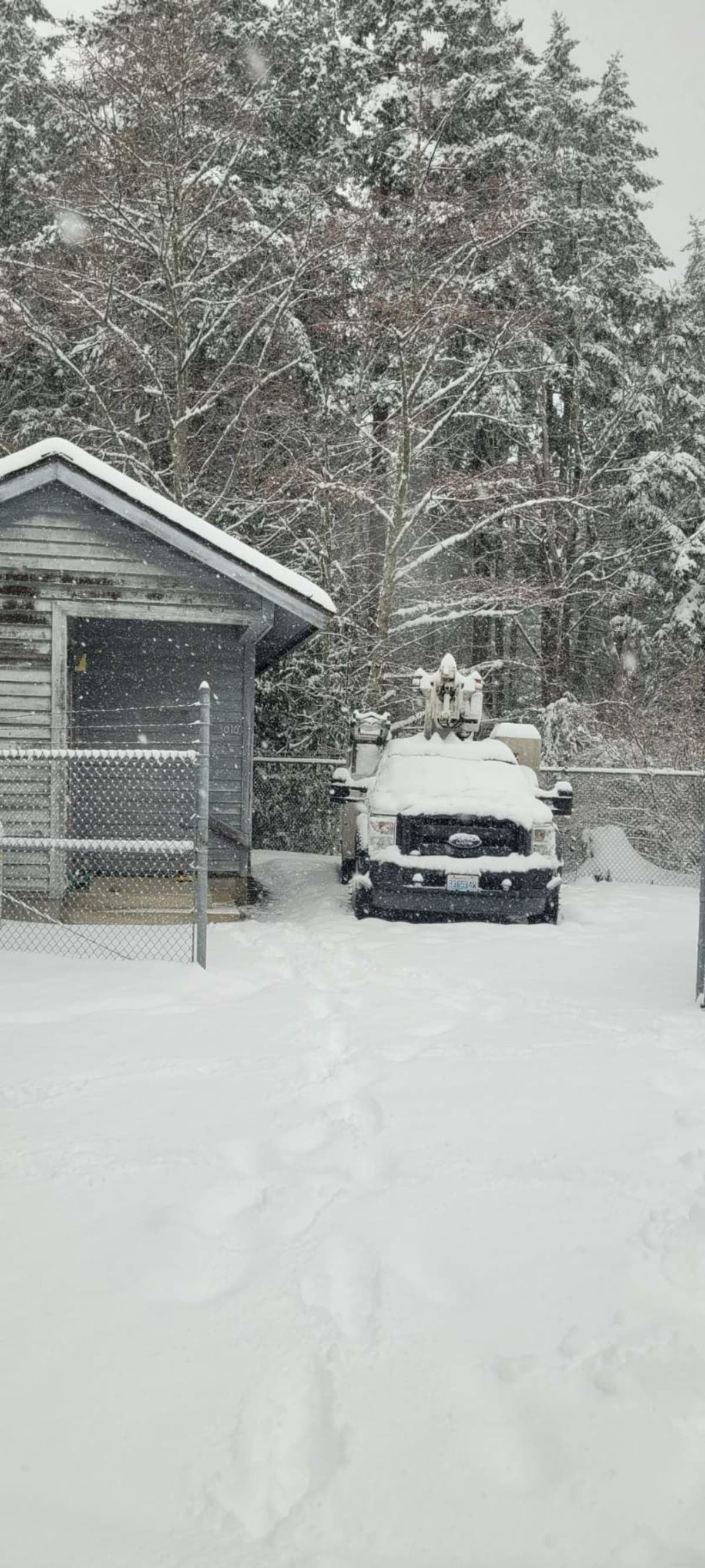 Ford aerial bucket truck in deep snow