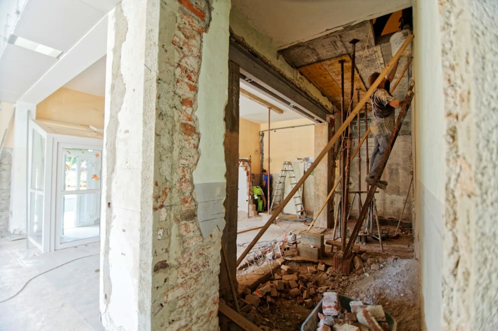 Before and after structural concrete repair on a Miami-Dade condominium column
