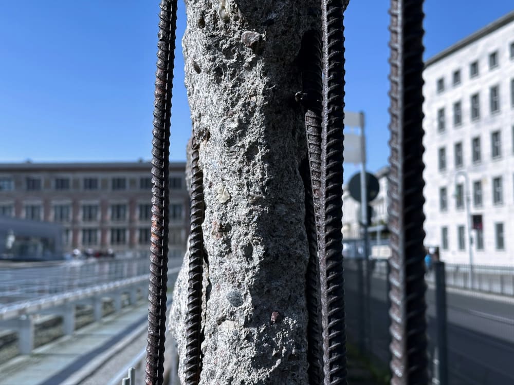 Exposed corroded rebar on a Miami parking garage beam requiring structural repair