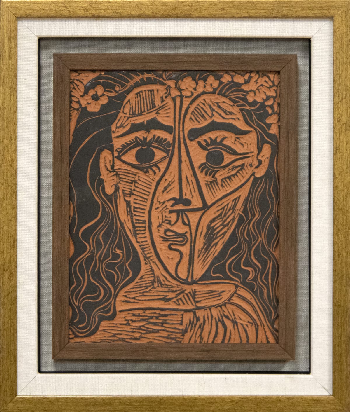 Tête de femme à la couronne de fleurs, 1964, terracotta with black slip